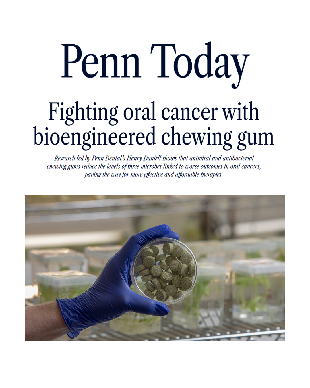 article page with gloved hand holding a specimen dish with chewing gum bioengineered to fight oral cancer